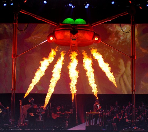 Photo by Roy Smiljanic , courtesy of thewaroftheworlds.com A Martian Fighting Machine opens fire on stage