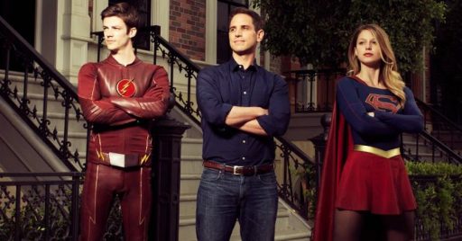 Grant Gustin, executive Greg Berlanti and Melissa Benoist pose during the Supergirl/Flash crossover last year for Variety